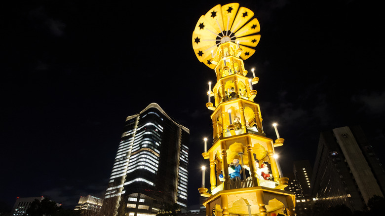 The illuminated Christmas Pyramid of Tokyo Christmas Market 2018 at Hibiya Park in Chiyoda, Tokyo, Japan in the evening.