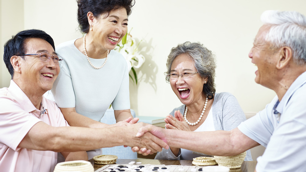 a group of Chinese friends laughing