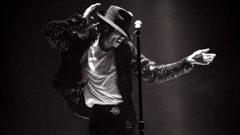 Michael Jackson dancing near microphone