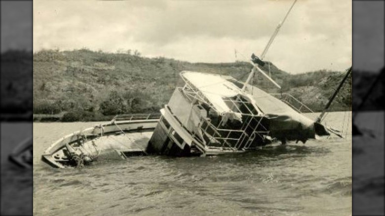 MV Joyita partially submerged on side