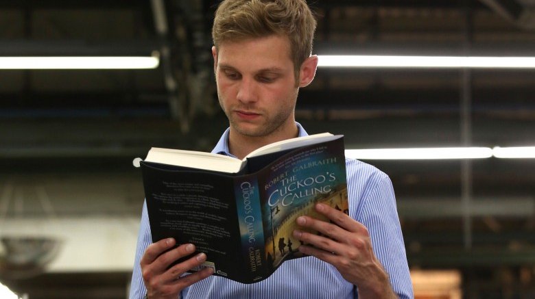 man reading cuckoo's calling galbraith