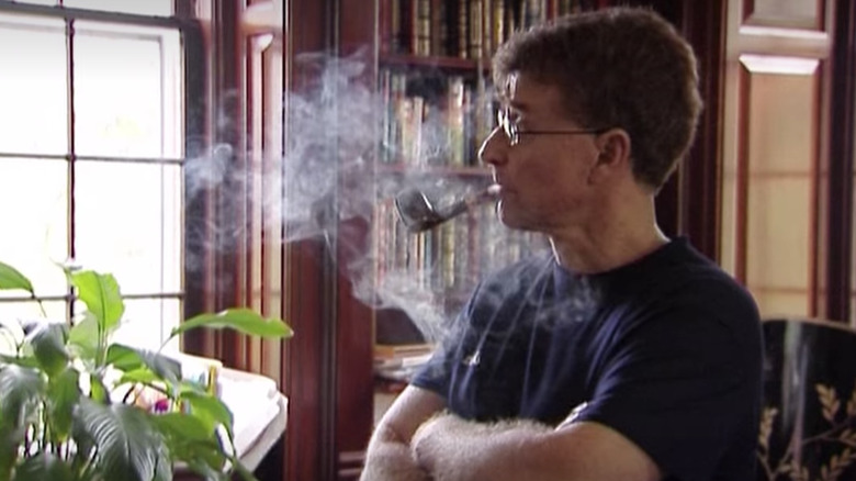 Michael Peterson smokes a pipe