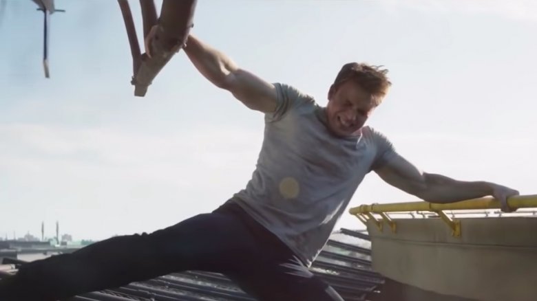 Chris Evans hanging on to the helicopter