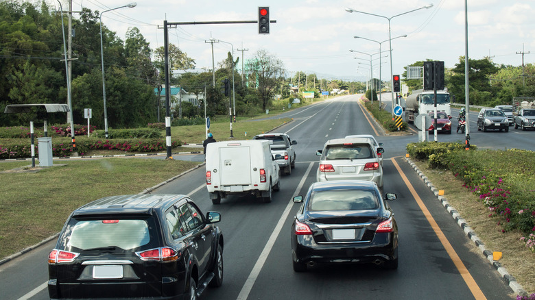 Cars waiting in line at traffic light 