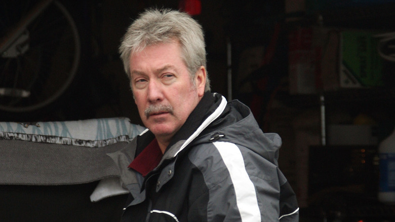 Drew Peterson in front of his house