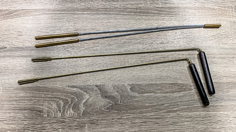 dowsing rods metal on wooden table