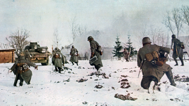 German soldiers follow tank in snow