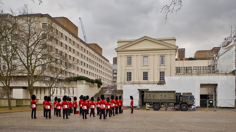 british military guards lined up by barracks