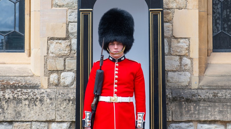 british military guard holding gun