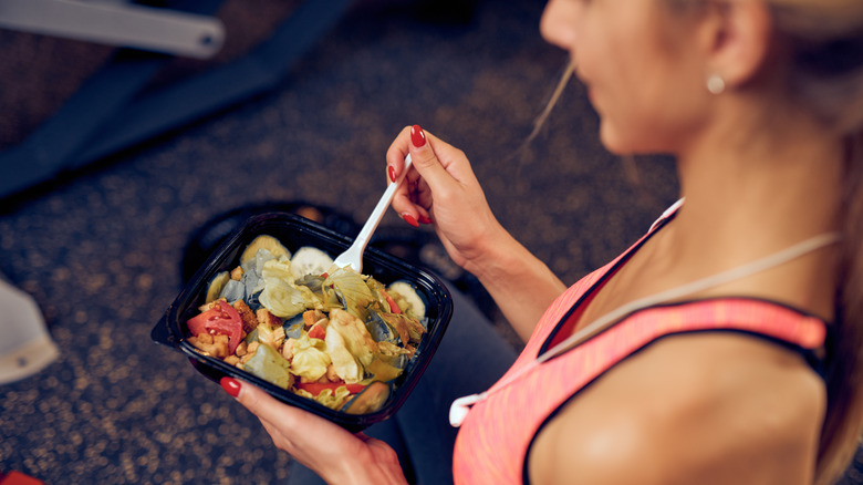 top view women eating in gym