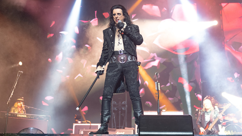 Alice Cooper singing into microphone