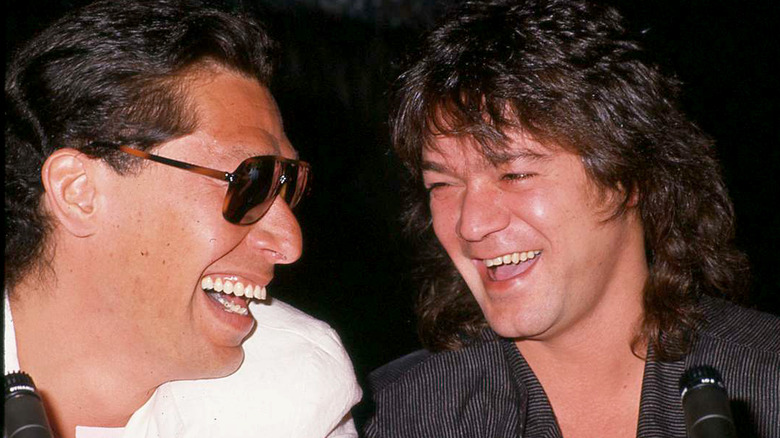 Alex Van Halen and Eddie Van Halen laughing