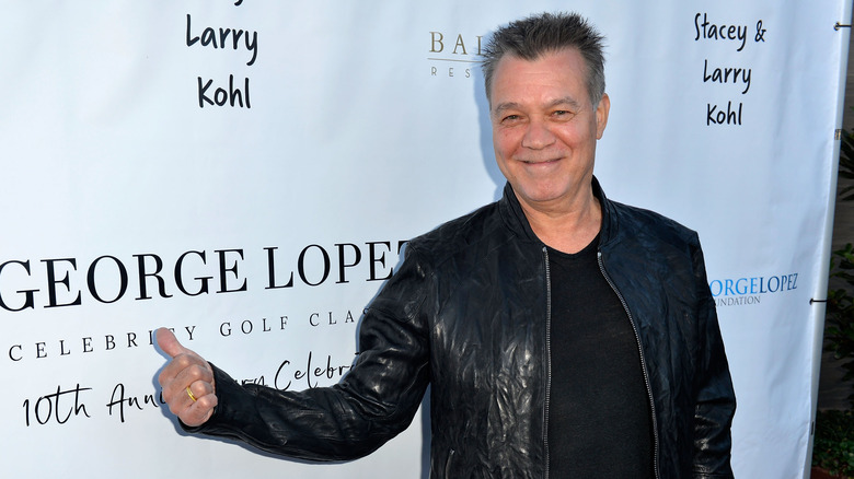 Eddie Van Halen smiling leather jacket at event