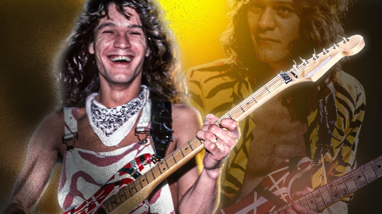 Eddie Van Halen smiling holding his guitar