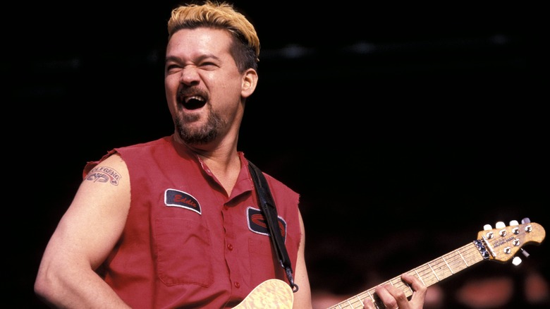 Eddie Van Halen smiling red shirt performing onstage