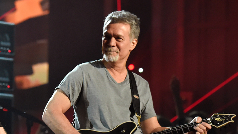 Eddie Van Halen playing guitar onstage