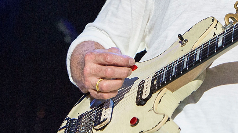 Eddie Van Halen playing guitar onstage closeup