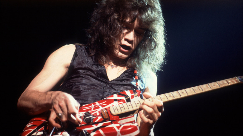 Eddie Van Halen playing guitar onstage in 1979