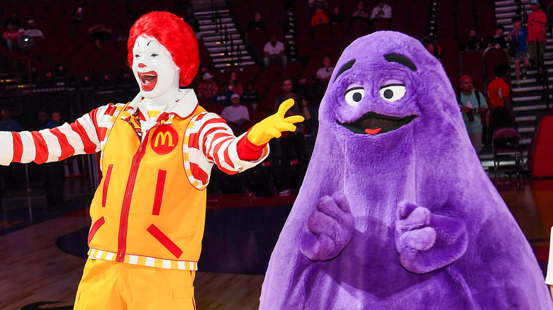 ronald mcdonald arms open with grimace