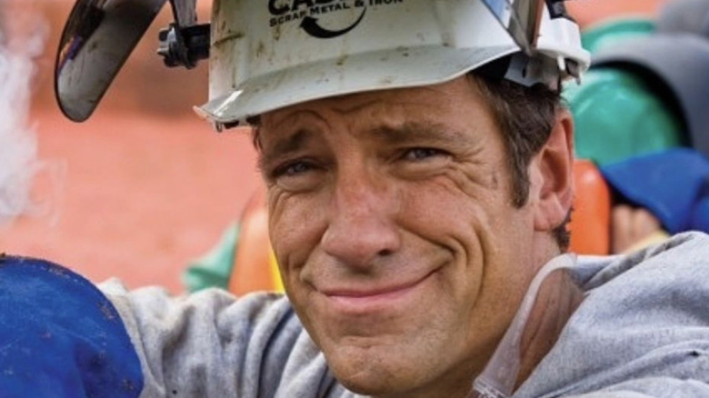 mike rowe wincing dirty clothes protective gear