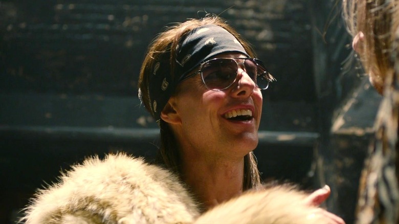 Stacee Jaxx bandana furry coat sunglasses smiling