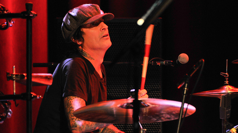 Tommy Lee hat red-lit playing drums