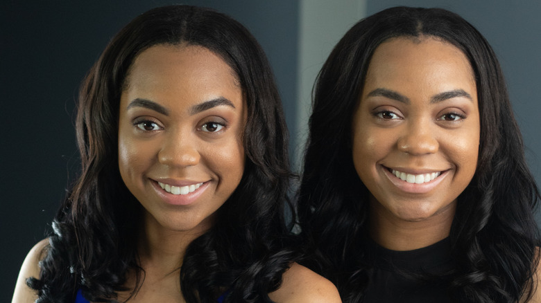 Twin women smiling