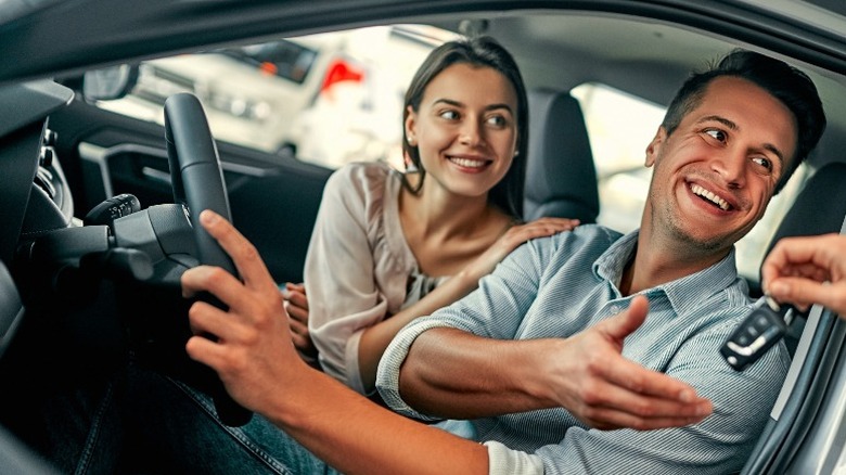 couple inside a parked car