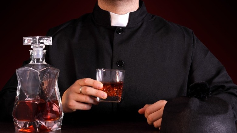 priest drinking alcohol