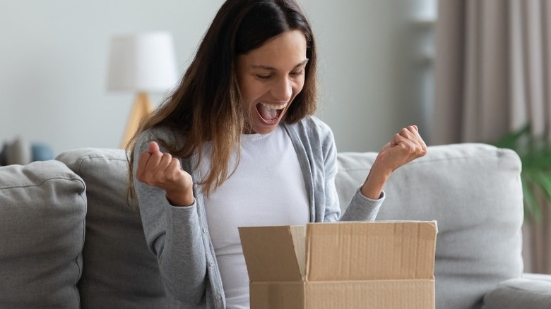 woman opening package