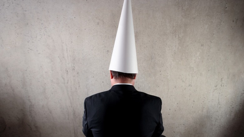 man in dunce cap