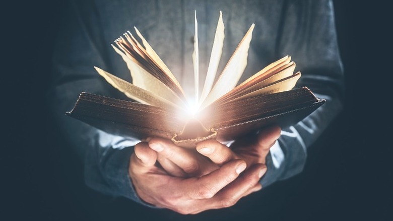 man holding open bible