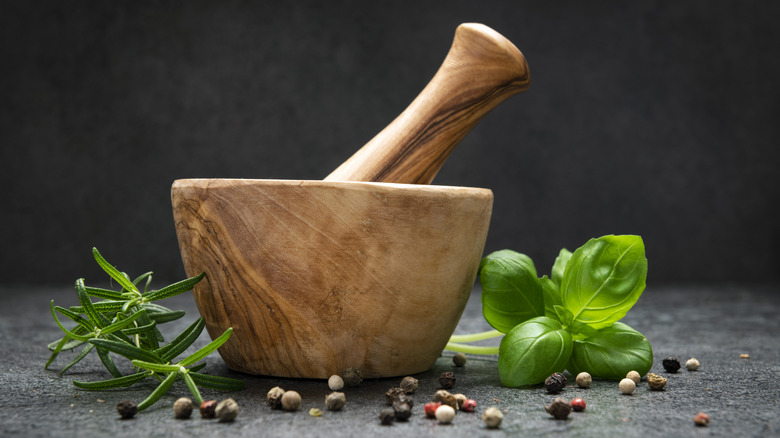 mortar and pestle with herbs