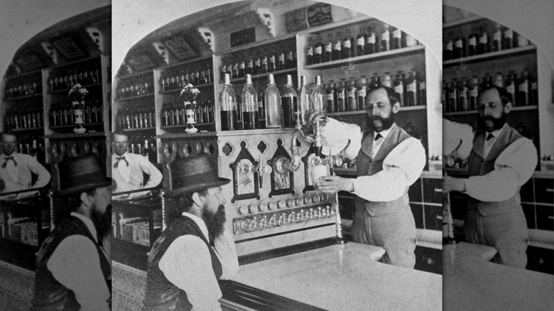 man operating soda fountain