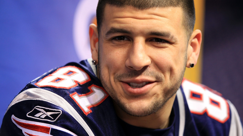 aaron hernandez wearing his patriots jersey answering questions