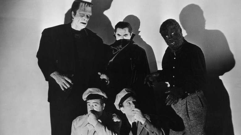 Abbott and Costello cower from monsters