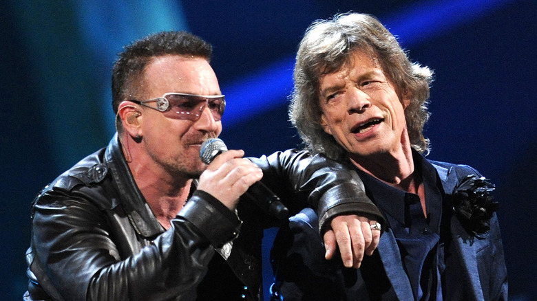 Bono and Mick Jagger onstage