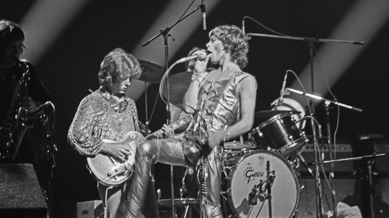 Mick Taylor and Mick Jagger perform