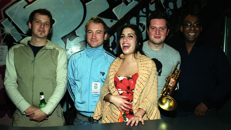 Amy Winehouse laughing with band 