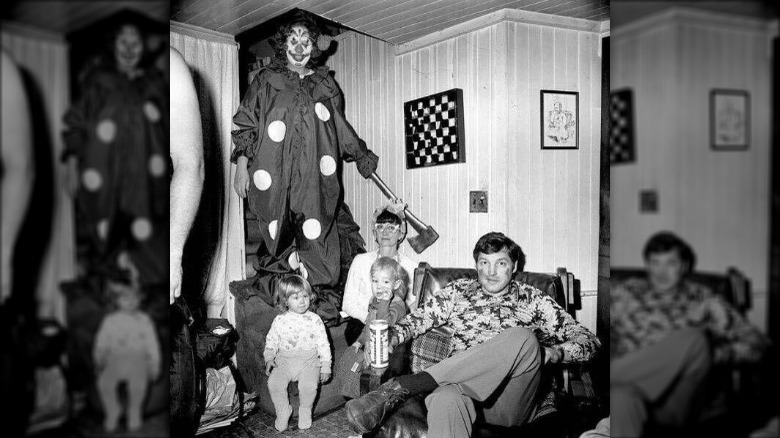 Scary clown with ax in family photo