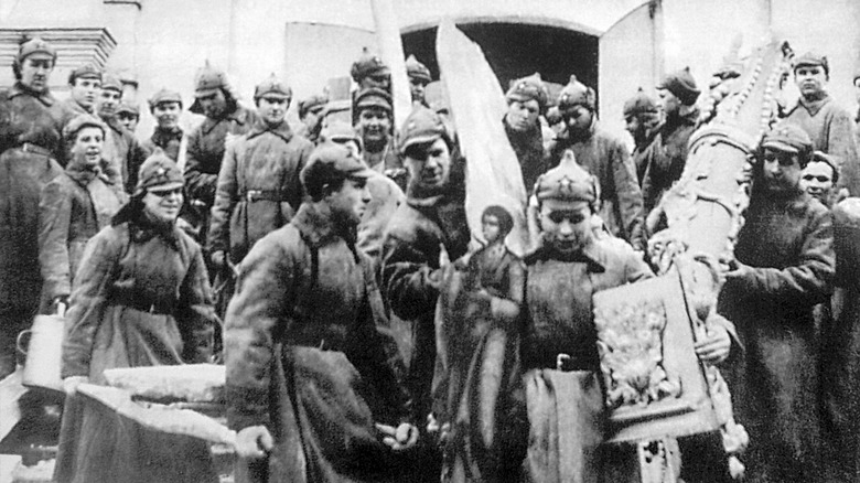 Red Army men confiscating church treasures