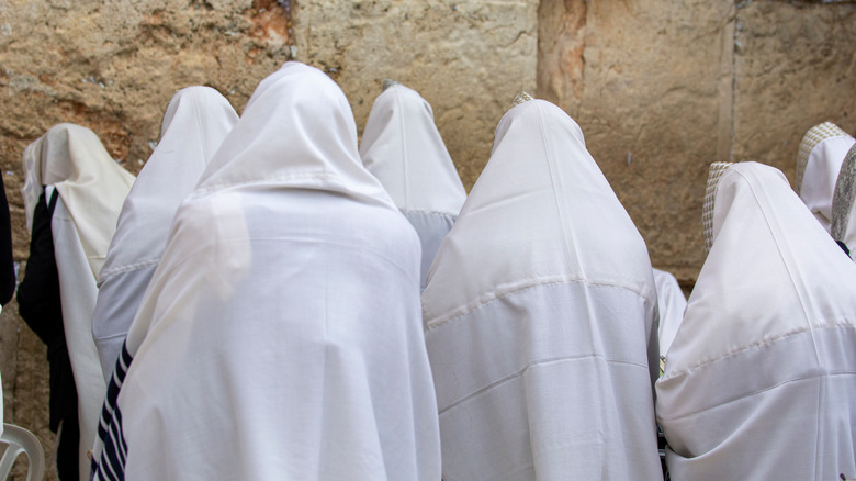 Jewish men praying at Western Wall