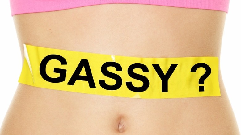 word gassy on woman's stomach