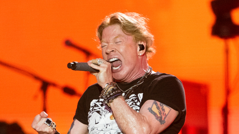 Axl Rose singing into microphone