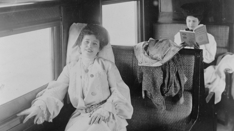 two women aboard passenger train