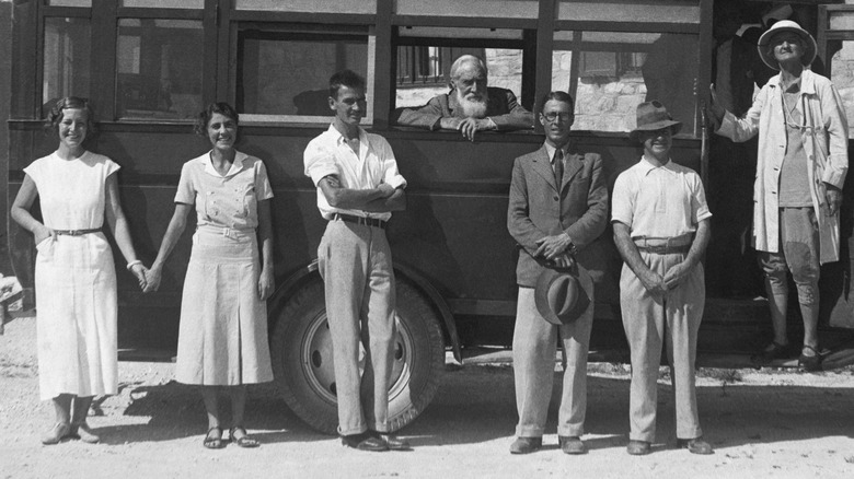 Flinders Petrie and other archeologists around a bus