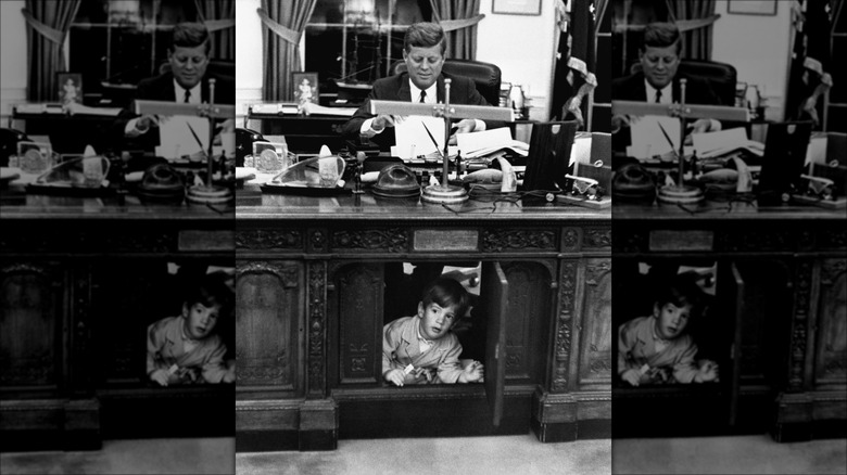 John Jr. playing under Resolute Desk