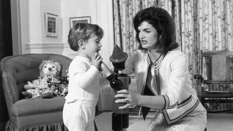 Jackie Kennedy playing with John Jr.