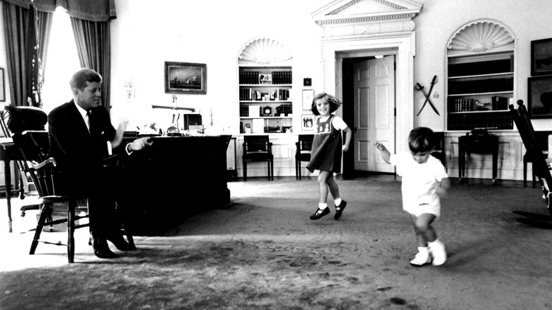 JFK in Oval Office with playing children