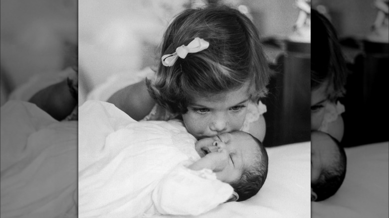 Caroline Kennedy kisses baby brother